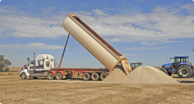 Truck delivering limesand to a paddock