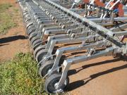 Seeder press wheels with setup for banding wetting agents