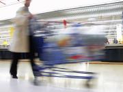 shopping trolley being pushed by consumer