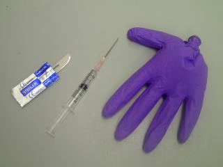 scalpel blade syringe and glove