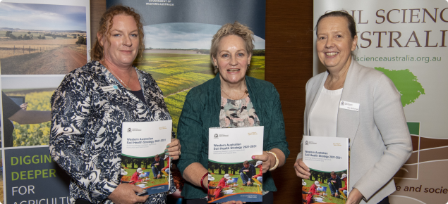 Dr Hayley Norman, the Hon. Alannah MacTiernan MLC and Cec McConnell display the WA Soil Health Strategy Policy
