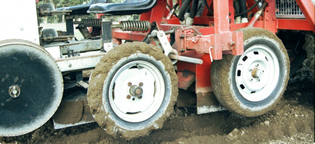 Two 15cm wide rotary hoes contained within metal housings under a vegatable planter