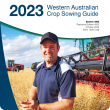 Cover of the 2023 WA Crop Sowing Guide showing Peter Cowan in his canola crop before harvest at Mt Walker