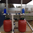 Fertiliser dosing system using two tanks