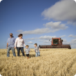 A family standing in a field of wheat