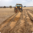 One-way disc plough in action