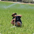 Technical Officer Mark Stanaway checks a sprinkler during an irrigation assessment