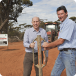 Agriculture and Food Minister Ken Baston and Department of Agriculture and Food State Barrier Fence Project Manager Craig Robins at the site of construction to close the Yilgarn Gap.