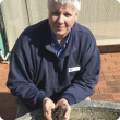 Man holding soil in his hand