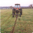 tractor pulling mole plough to dig a mole drain